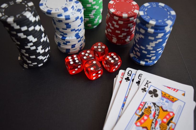 Casino chips, dice and cards illustrating Bitcoin casinos Canada deposits for Canadian online casino slots