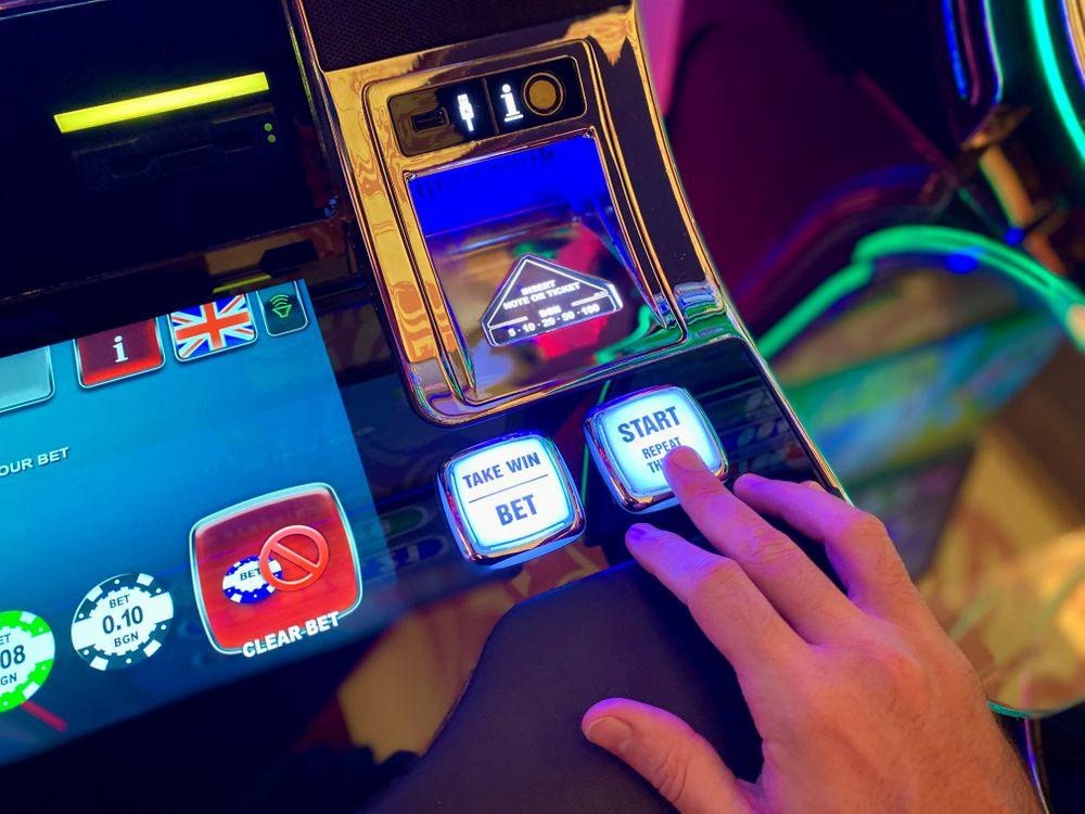 Close-up of an online casino slot machine interface with BET and START buttons