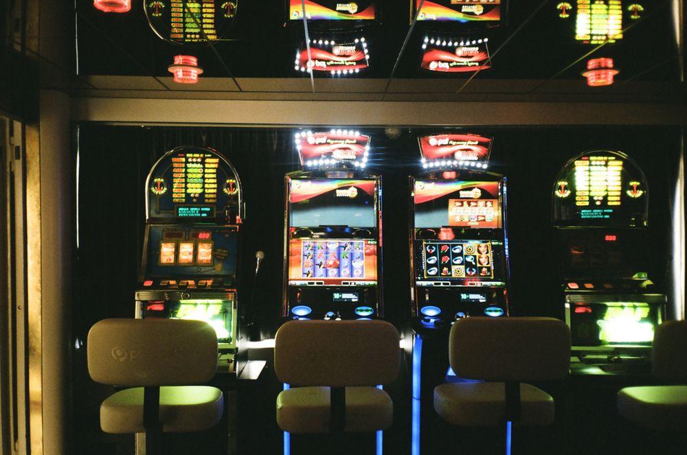 Row of casino slot machines representing NetEnt online slots for Canadian players