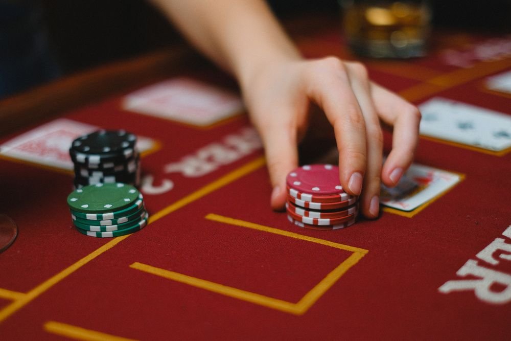 Casino table with poker chips and cards for Stellar XLM slots play